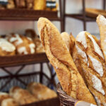 Bread baguettes in basket at baking shop